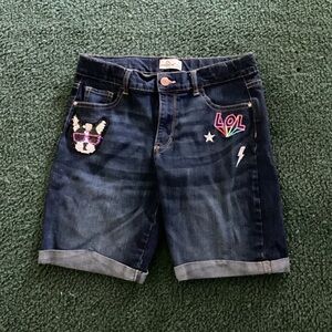 Girls Jordache size 14 shorts with an “Lol”, Star, lightning, and a sequin dog.